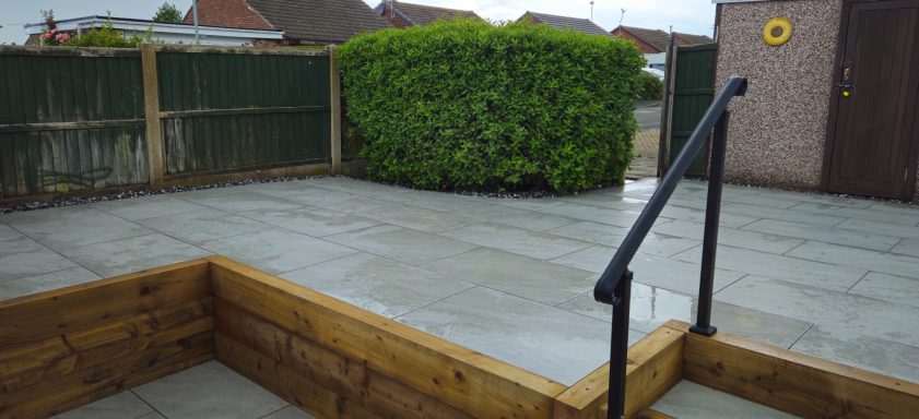 Raised patio, porcelain slabs & Turf