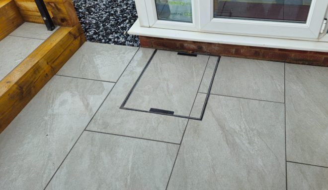 Raised patio, porcelain slabs & Turf